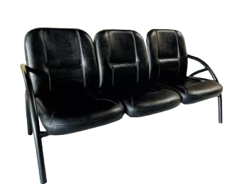 A black couch with three seats on a black background