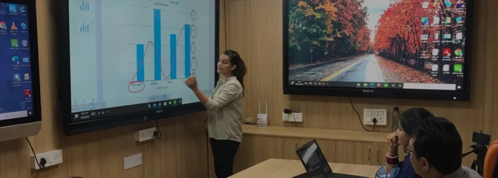 A Girl giving a presentation in meeting use interactive flat panel