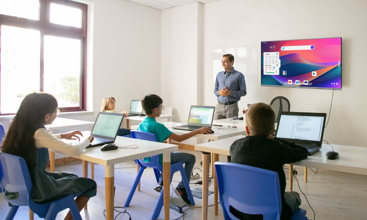 A Teacher Teach a students in smart classroom