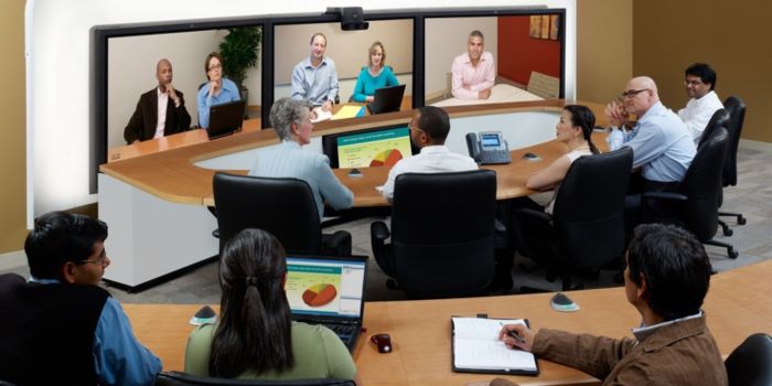 employees attend Remort meeting on interactive flat panel display in office